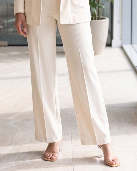 Ivory wide-leg trousers, as styled on Meera